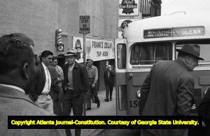 African American men preparing to board a segregated bus in an act of civil disobedience, Atlanta, Georgia, January 9, 1957.