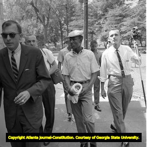 African American and the press approaching the newly integrated Lake Clara Meer, Piedmont Park, Atlanta, Georgia, June 12, 1963.