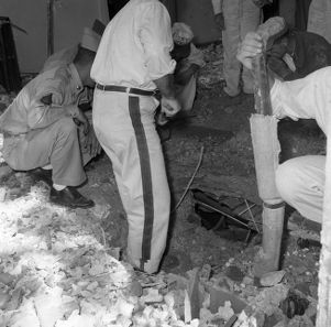 Army demolition experts, FBI agents, and city detectives search for clues at the Hebrew Benevolent Congregation (later known as simply The Temple) following a racially motivated bombing, Atlanta, Georgia, October 12, 1958.