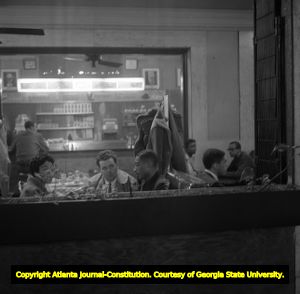 Police officers confronting two African Americans at a sit-in inside segregated Atlanta Union Station, Atlanta, Georgia, March 15, 1960.
