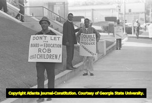 African American minister and picketers outside of the Atlanta Public Schools building, Atlanta, Georgia, September 19, 1967.