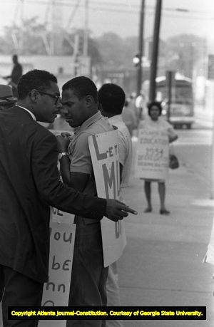 African American minister and picketers outside of the Atlanta Public Schools building, Atlanta, Georgia, September 19, 1967.