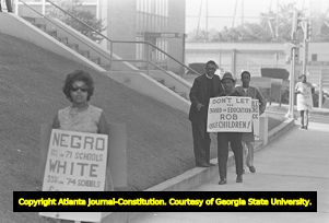 African American minister and picketers outside of the Atlanta Public Schools building, Atlanta, Georgia, September 19, 1967.