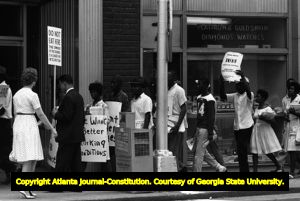 Civil rights marchers encounter segregationists on Forsyth Street, Atlanta, Georgia, July 1963.