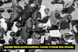 Lester Maddox and his followers picketing at the Atlanta Journal and Constitution building, Atlanta, Georgia, June 4, 1970.