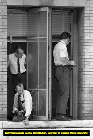 Marion Johnson with two other photojournalists for the Atlanta Journal-Constitution taking pictures of a Lester Maddox protest, Atlanta, Georgia, June 4, 1970.