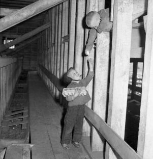 Young family members of Colonel William O. Poindexter gathering fresh eggs, Rebel House (formerly the Rutlidge Home plantation), LaGrange, Georgia, January 27, 1959.