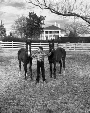 Young family member of Colonel William O. Poindexter with horses, Rebel House (formerly the Rutlidge Home plantation), LaGrange, Georgia, January 27, 1959.