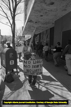 Atlanta Committee Against Registration and the Draft (ACAD) protesters in front of Jimmy Carter's campaign headquarters, Atlanta, Georgia, March 15, 1980.