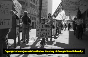 Atlanta Committee Against Registration and the Draft (ACAD) protesters in front of Jimmy Carter's campaign headquarters, Atlanta, Georgia, March 15, 1980.
