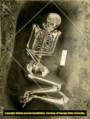 Skeleton in fetal position found at the Ocmulgee Indian ceremonial mound. Macon, Georgia, 1936. Coordinate drawing imposed over the photograph.