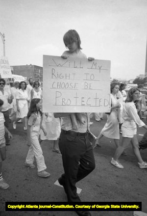 Man and child in a pro-choice march, Atlanta, Georgia, August 23, 1980.