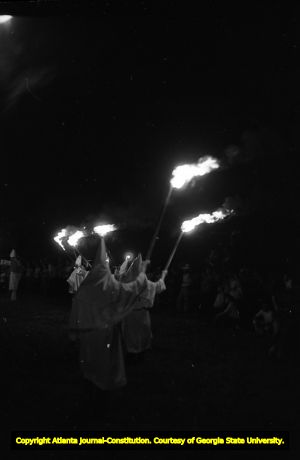 Ku Klux Klan members with torches at a KKK rally in Buchanan, Georgia, June 20, 1981.