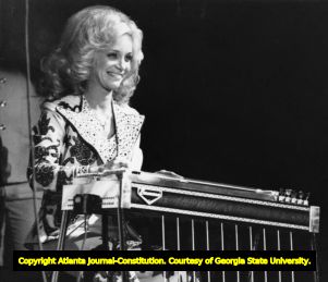 Barbara Mandrell performing on a pedal steel guitar at the Georgia World Congress Center, Atlanta, Georgia, December 4, 1977.