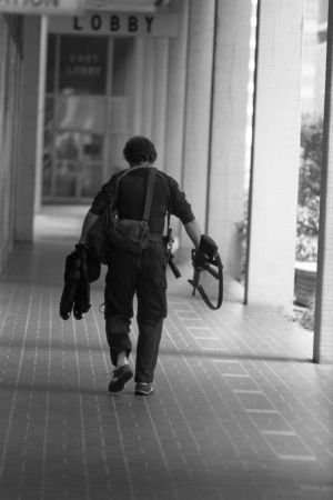 SWAT team member entering Atlanta's F.B.I. headquarters during a hostage situation, Atlanta, Georgia, June 29, 1981.