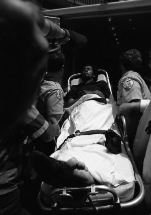 Wounded hostage leaving Atlanta's F.B.I. headquarters on a stretcher, Atlanta, Georgia, June 29, 1981