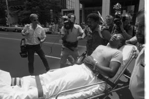Wounded hostage leaving Atlanta's F.B.I. headquarters on a stretcher, Atlanta, Georgia, June 29, 1981