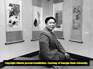 Dr. Fan Bao-Wen, dean of fine arts at Nanjing Normal University in China, at an exhibit of his school's faculty artwork, Kennesaw State University (then Kennesaw College), April 28, 1988.