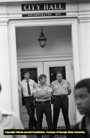 Police standing by city hall in Cartersville, Georgia, during an African American protest rally, September 22, 1980.