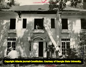 Margaret Mitchell's girlhood home being razed, Atlanta, Georgia, August 1952. Following Mitchell's death in August 1949, and because of a request she had made of her brother Stephens Mitchell, the house was razed in 1952.