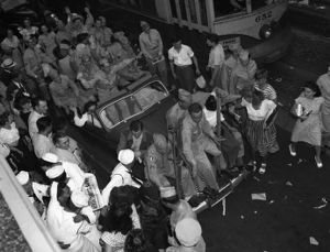 Soldiers and others celebrate V-J Day ("Victory over Japan Day") on Peachtree Street, Atlanta, Georgia, August 14, 1945.