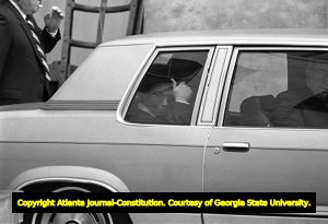 Serial murderer Wayne Williams giving a 'thumbs up' from the back of a police vehicle, Atlanta, Georgia, February 24, 1982.