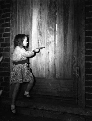 Young girl by a doorway at Barnsley Gardens golf resort, Adairsville, Georgia, March 1948.