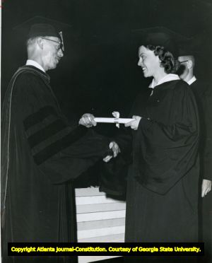 Barbara Diane Michel, one of Georgia Tech's first coeds recieves her diploma, Atlanta, Georgia, 1956. Michel was the first woman to graduate from Georgia Tech.