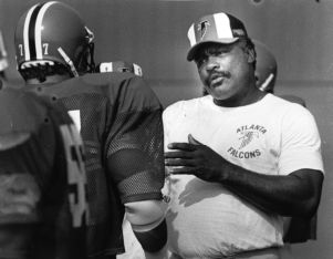 Falcon's coach Claude Humphrey talking to a player, Suwanee, Georgia, August 2, 1987.