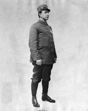 Bicycle policeman posing in uniform, Atlanta, Georgia, 1911.