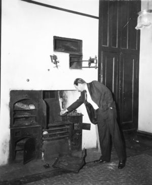 Bowling C. Yates, superintendent of the Kennesaw Battlefield National Park, examining the kitchen in Barnsley Gardens, near Adairsville, Bartow County, Georgia, circa March 1947.