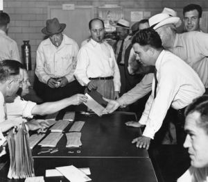 Trolley operators picking up their last checks before going on strike, Atlanta, Georgia, May 1950.