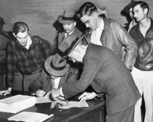 Workers recieve script for groceries from union officials during a strike against Atlantic Steel, Atlanta, Georgia, October 1949.