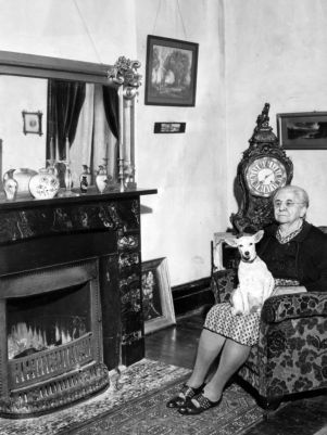 Mrs. Addie Saylor sitting in the former Billiards room at Barnsley Gardens, near Adairsville, Bartow County, Georgia, January 1942.