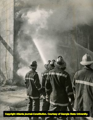 Firefighters dousing a fire, Atlanta, Georgia, 1960s?.
