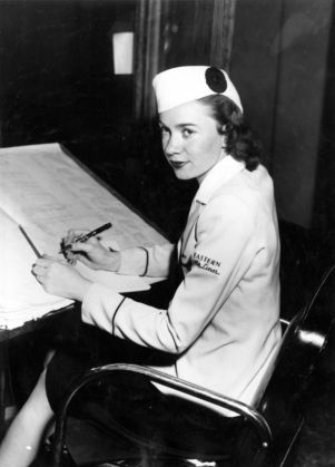 Eastern Airlines flight attendent preparing her passenger list, Atlanta, Georgia, May 1945.