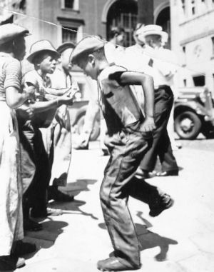 Children dancing in the street, Atlanta, Georgia, August 6, 1939.