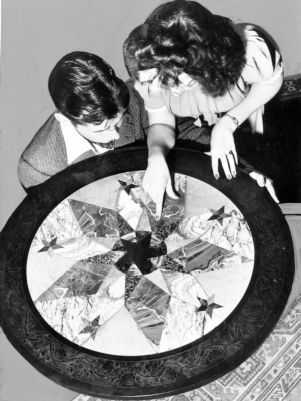 Tourists examine the imported inlaid table at Barnsley Gardens, near Adairsville, Bartow County, Georgia, September 1940.