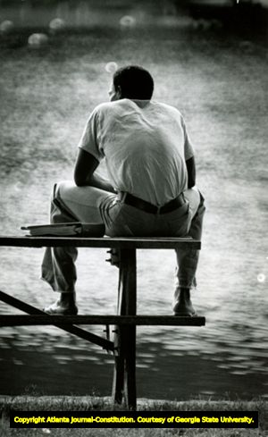 Atlanta Falcons Dennis Pearson sits by a lake on Furman University campus, Greenville, South Carolina, July 1978.