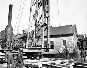 A pile driver preparing the foundation of a new building, Atlanta, Georgia, March 1940.