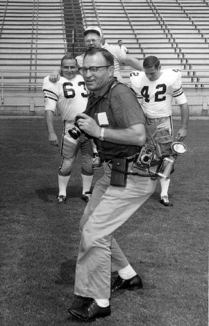 Atlanta Journal Constitution photographer Bill Wilson shooting Georgia Tech football players, Atlanta, Georgia.