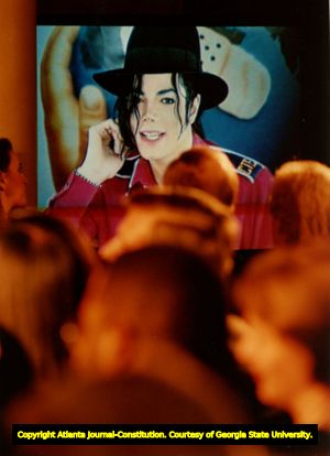 Michael Jackson talks live via satellite at Carver High School, for The Atlanta Project's immunization program, Atlanta, Georgia, March 1993.