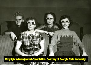 Four women wearing polarized glasses at a viewing of the first three dimensional movie "Bwana Devil," 1953