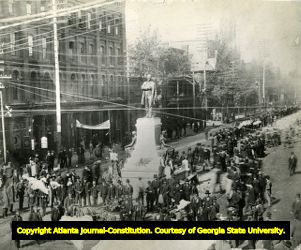 Fraternal Order of Red Men gather at the Grady Monument before marching to the exposition in Piedmont Park, 1895