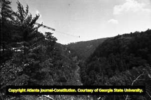 Karl Wallenda approaching the middle of his tightrope walk across Tallulah Gorge, 1970
