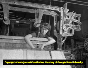 Woman industrial worker using an asbestos fabric loom, 1947