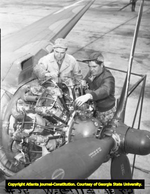 Aircraft mechanics work on an engine at the Atlanta Army Air Base, 1945