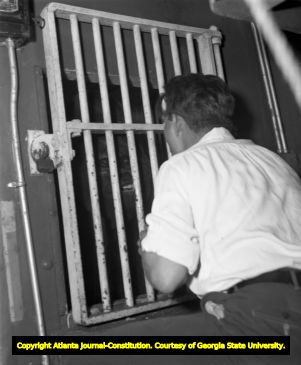 Gargantua in his cage with Ringling Bros. gorilla trainer, 1946