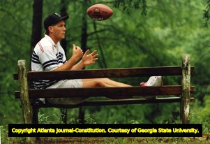 Brett Favre sits on a bench in his hometown of Kiln, Mississippi, 1991