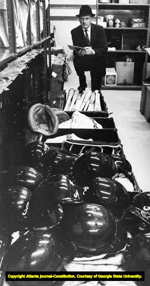 Manager Mark Gladulich takes inventory of the baseball supplies before leaving for spring training, 1969